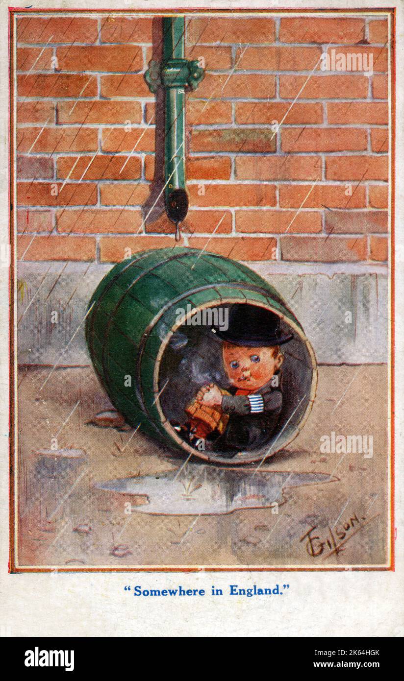 A young English lad takes shelter in a barrel from the pouring rain