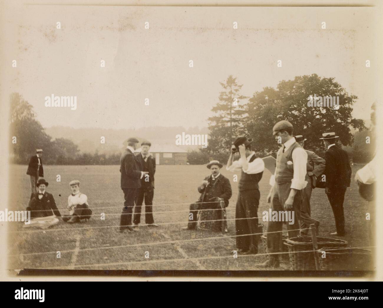Men engaged in sporting activity in a field, possibly in Oxfordshire Stock Photo