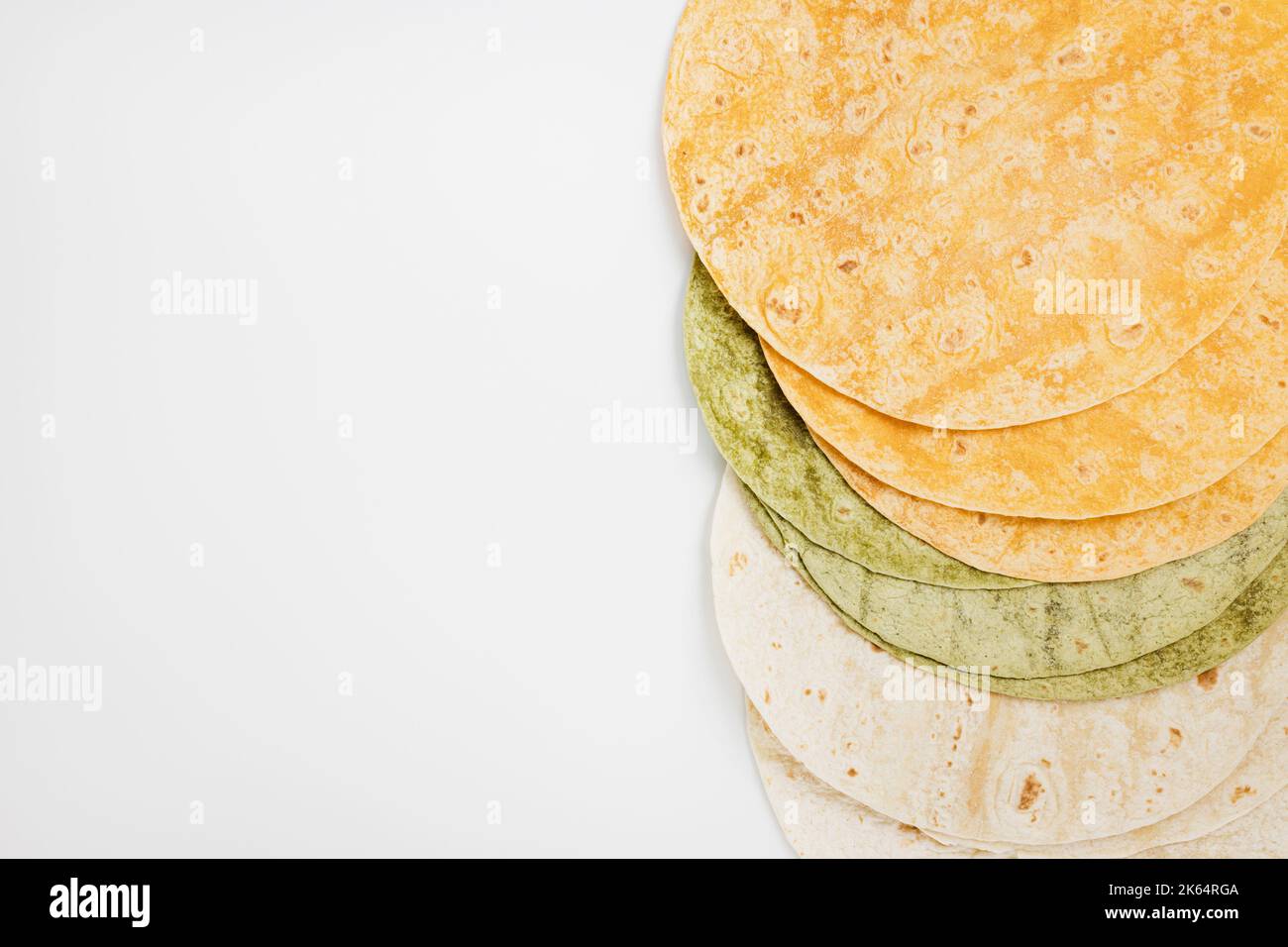 Tomato, spinach flavored and plain wheat tortilla wraps. Spanish or