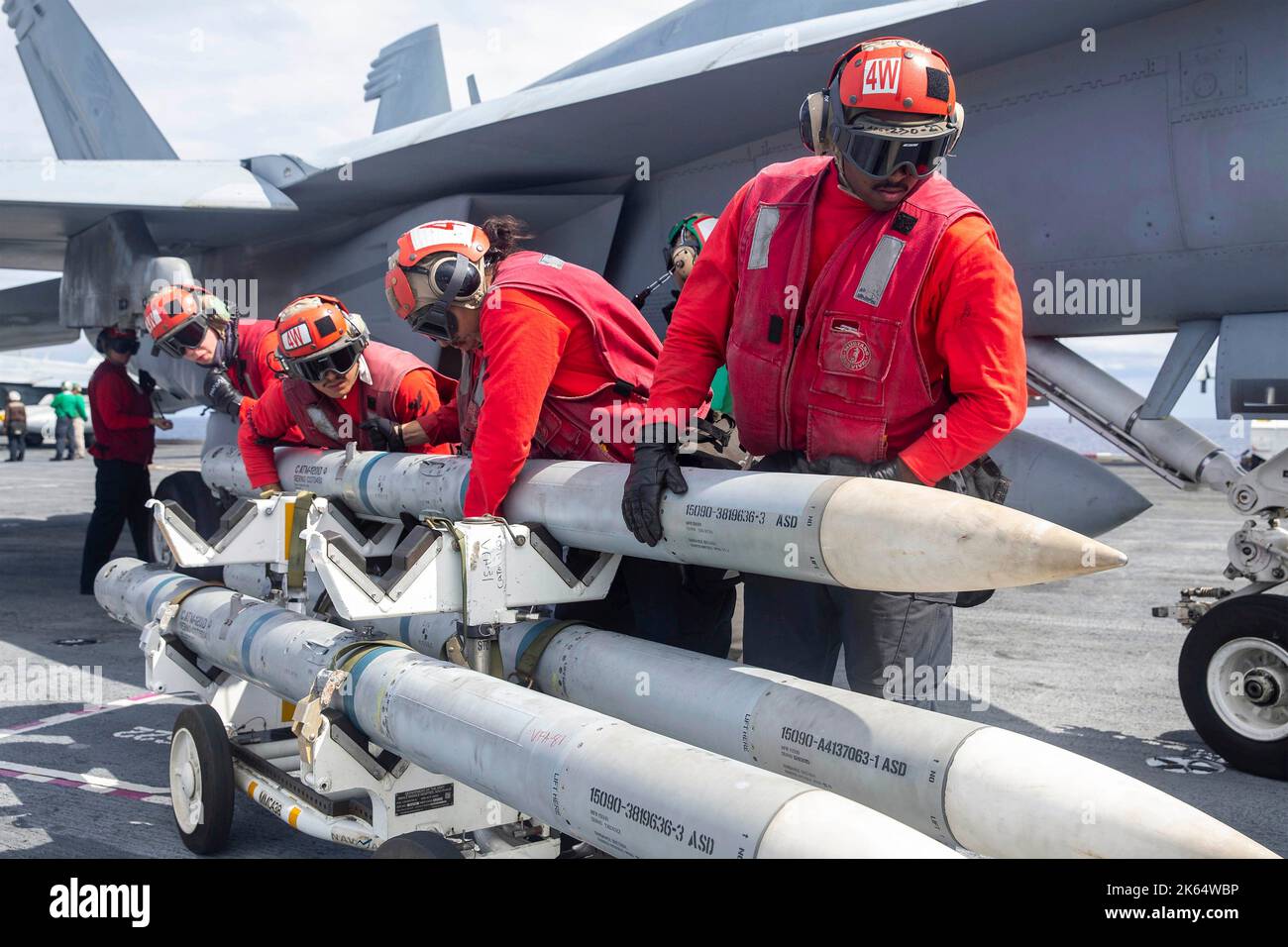 Atlantic Ocean, Spain. 11 October, 2022. U.S. Navy sailors load AIM-120 air-to-air missiles on a F/A-18E Super Hornet fighter jet aboard the USS Gerald R. Ford, lead ship in the Ford Class Aircraft Carriers, October 11, 2022 near Spain. Credit: MC2 Jackson Adkins/U.S. Navy Photo/Alamy Live News Stock Photo
