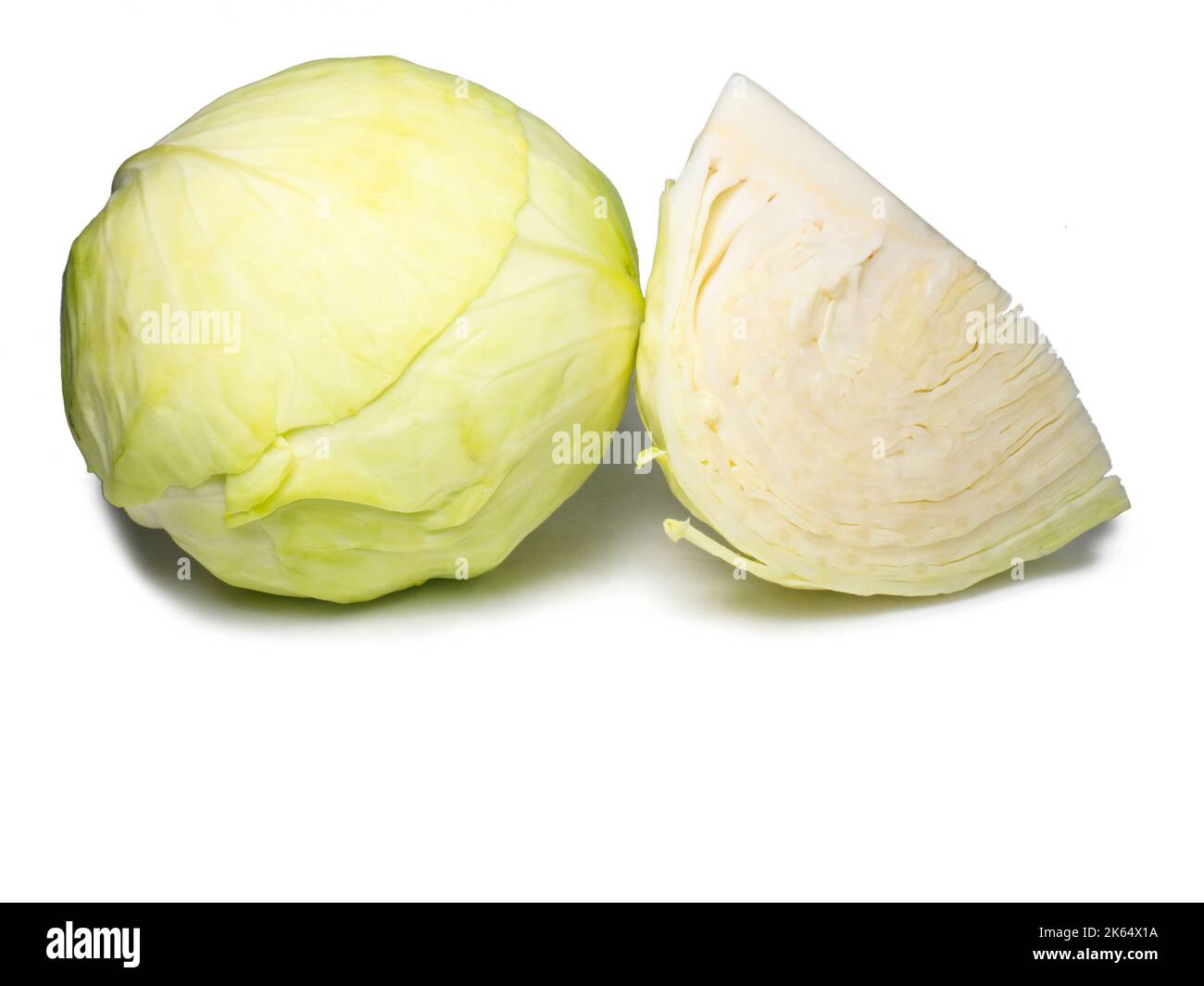 Pieces of white cabbage on a white background. From the garden
