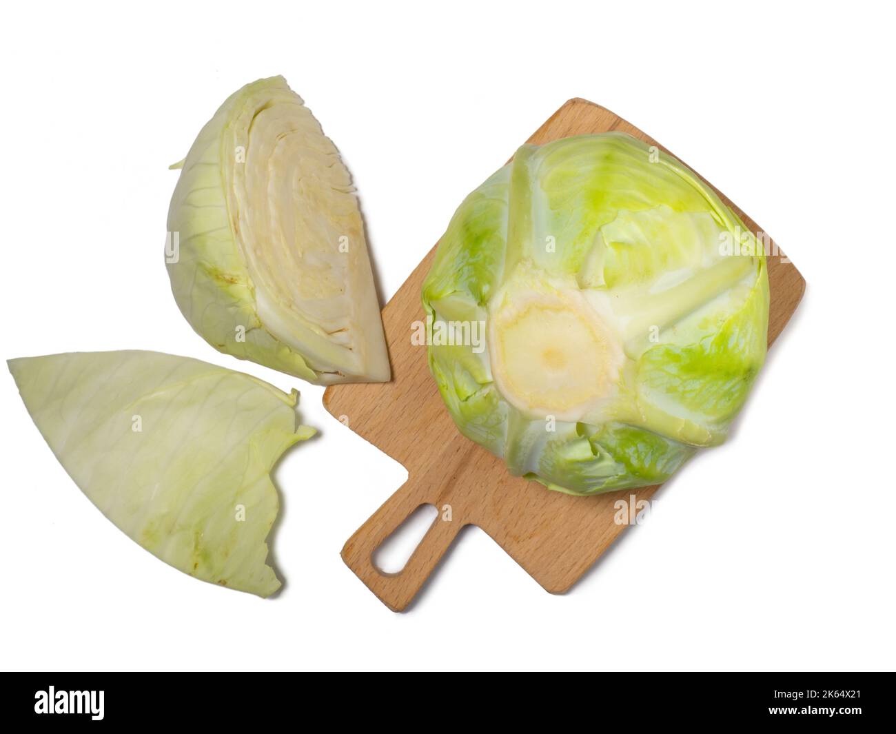 Pieces of white cabbage on a kitchen board on a white background ...