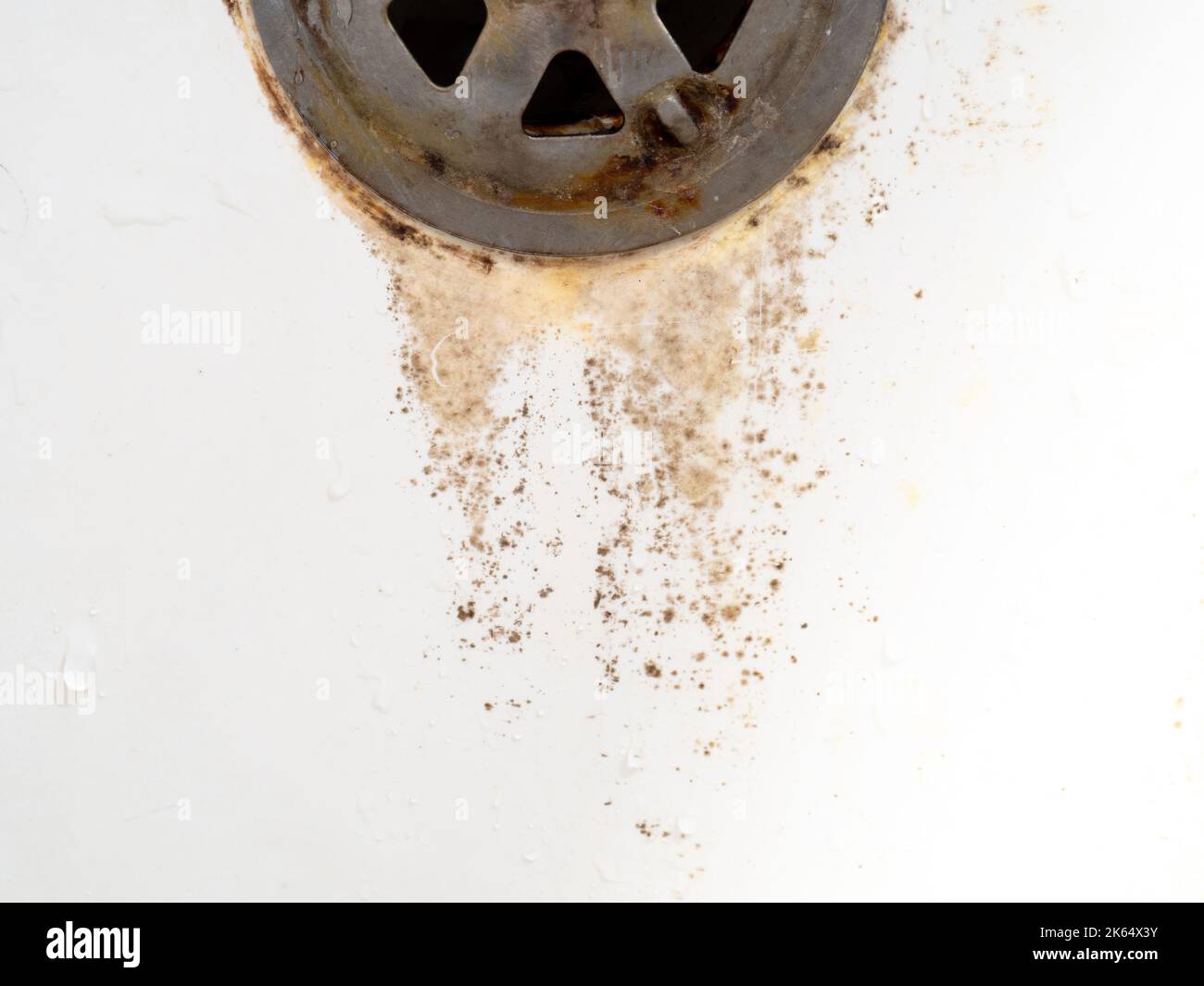 Rusty drain overflowing for the bathroom. Mold on bathroom faucet. Old