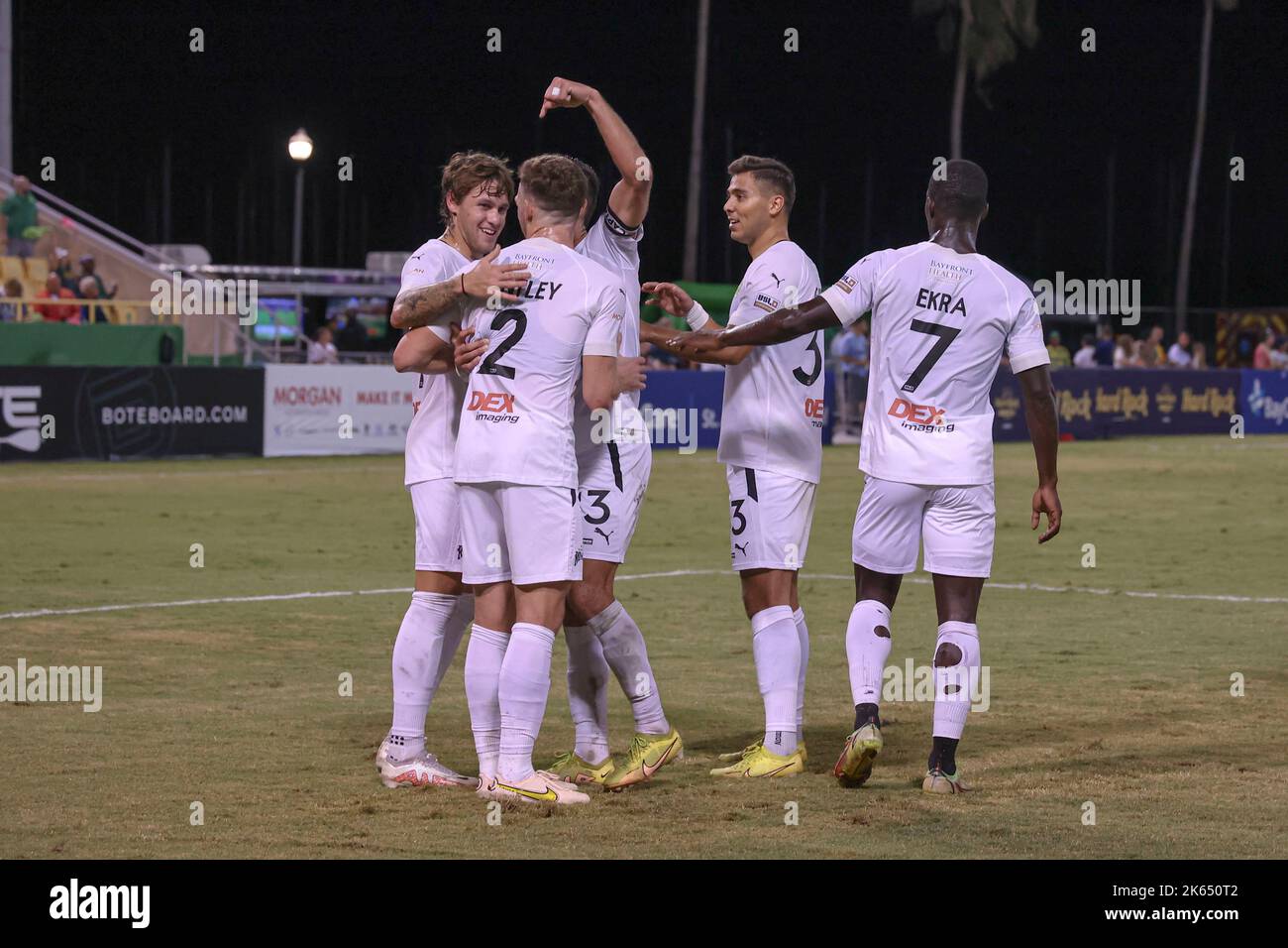 St. Petersburg, FL: Tampa Bay Rowdies forwards Jake LaCava (19) and Sebastián Guenzatti (13) who is pointing points to defender Conner Antley (2) who Stock Photo