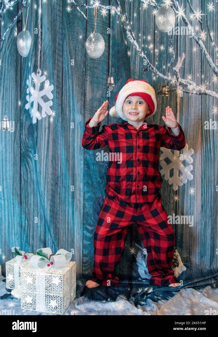 Young boy anxiously awaiting Christmas Stock Photo
