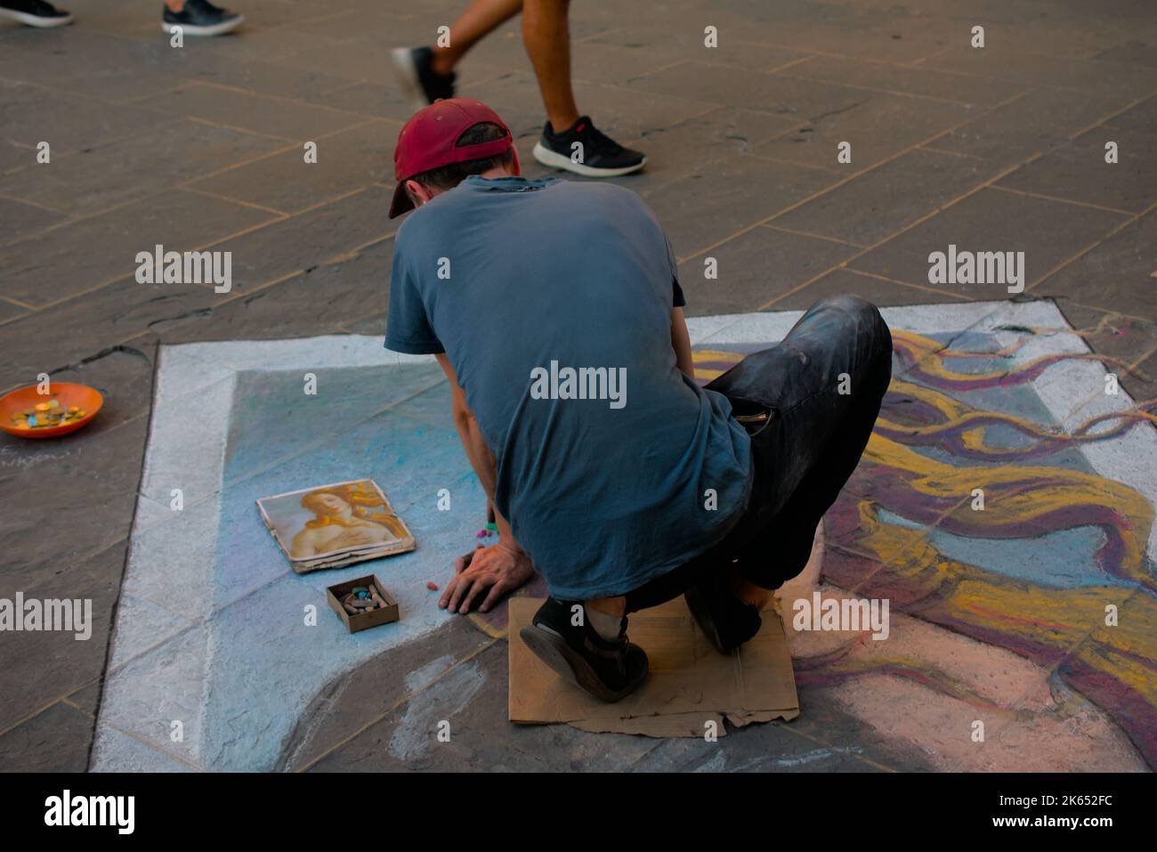 Street artist drawing the birth of venus in a busy street, Florence, Italy Stock Photo