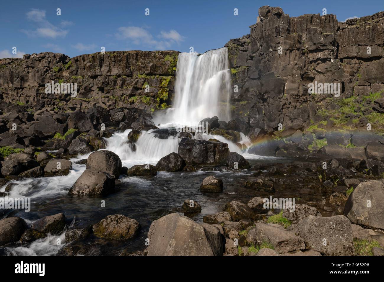 Öxarárfoss Waterfall with a rainbow, located in Thingvellir National Park in Iceland Stock Photo