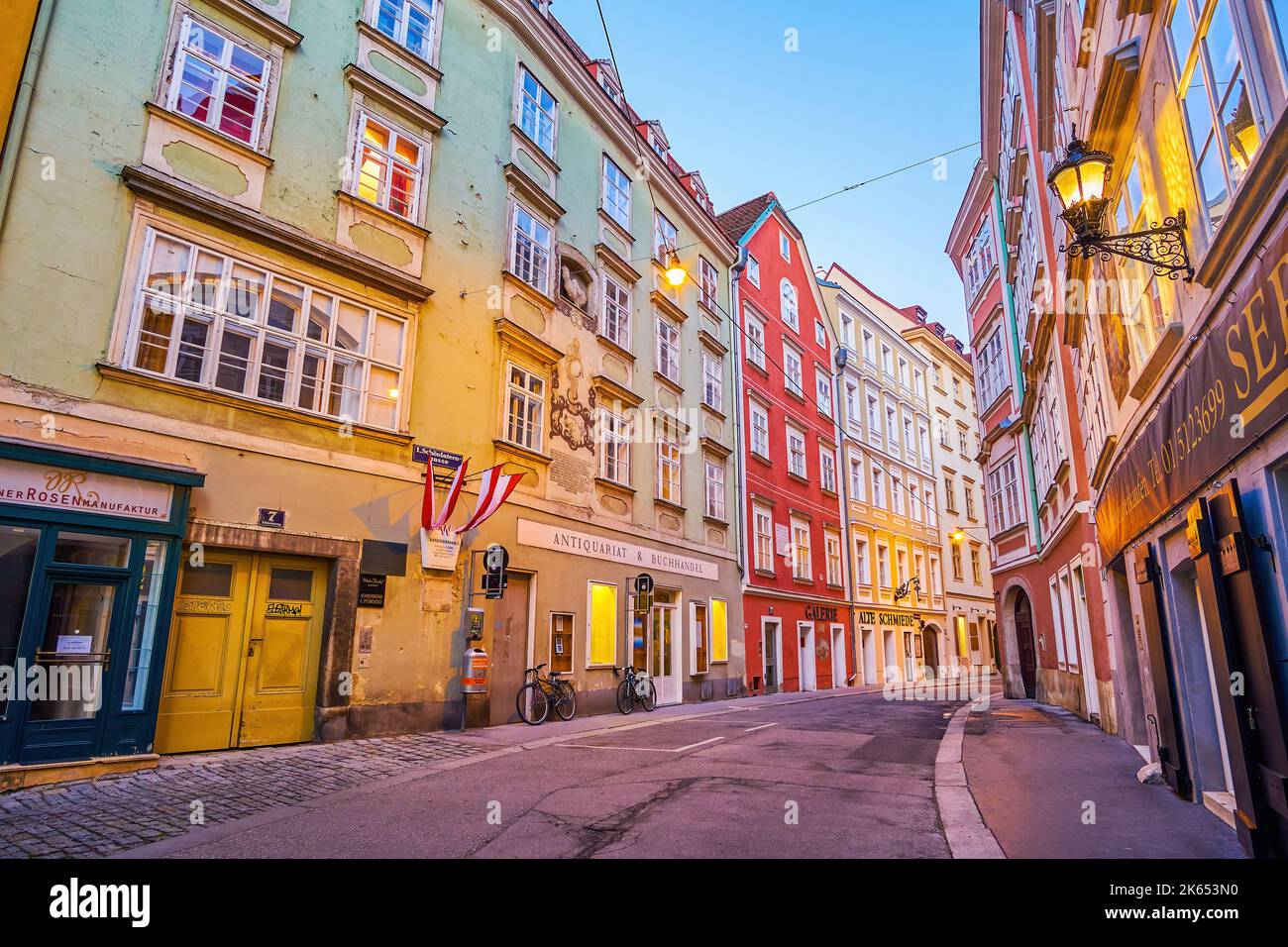 VIENNA, AUSTRIA - FEBRUARY 17, 2019: The evening walk along curved Schonlaterngasse street with colorful medieval townhouses, on February 17 in Vienna Stock Photo