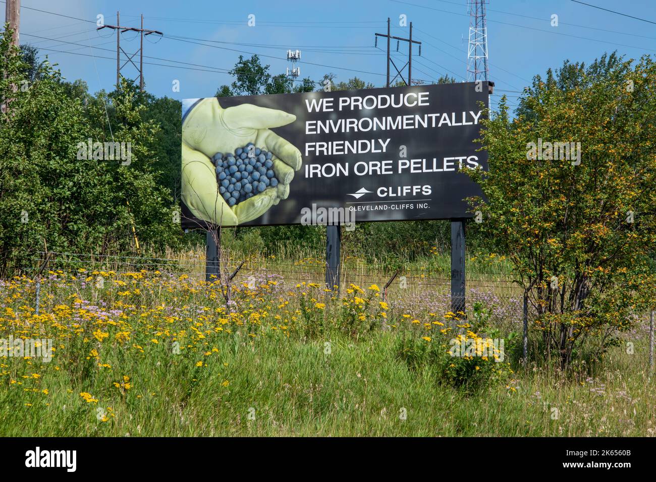 Silver Bay, Minnesota.  Cleveland-Cliffs Northshore Mining saying their iron ore pellets are environmentally friendly on a billboard ad. Stock Photo