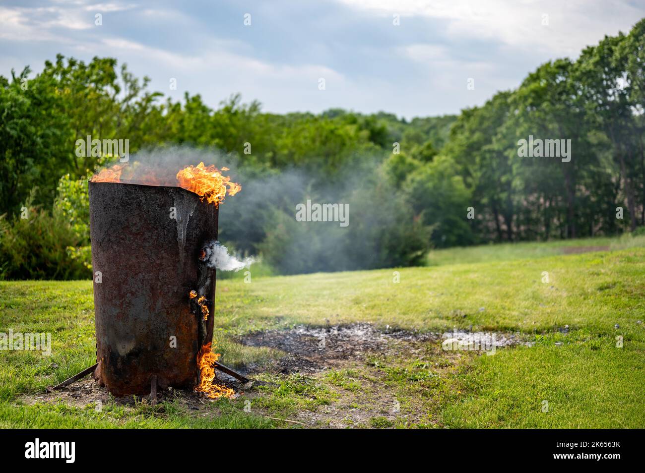 Burn barrel in a rural area used to incinerate trash and garbage Stock