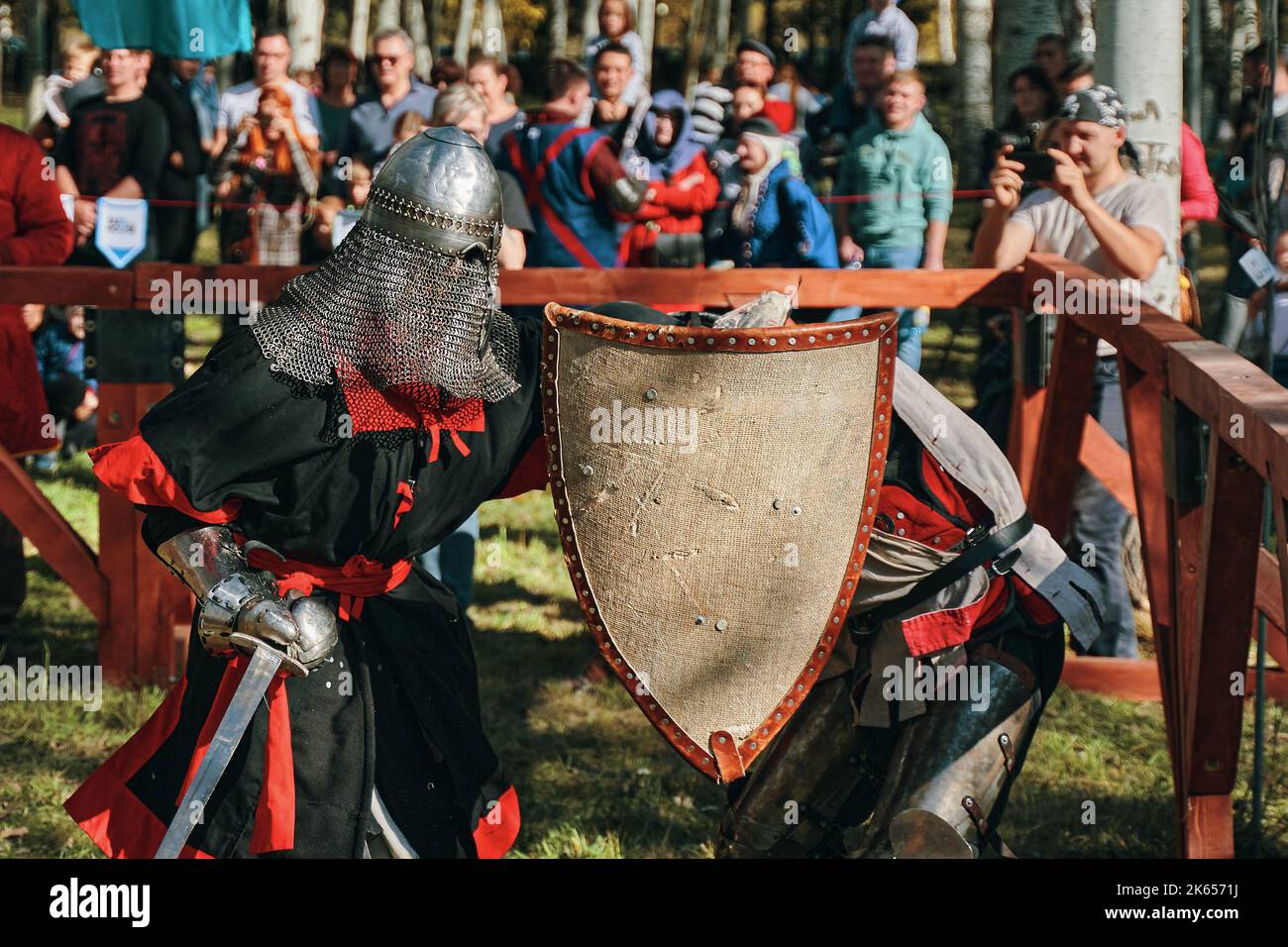 Battle of knights in armor and helmets on swords Stock Photo - Alamy