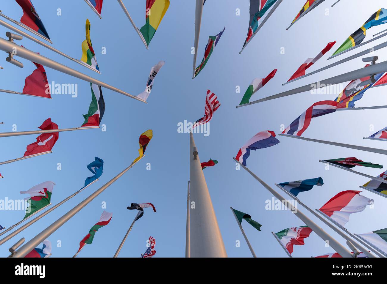 Flags of the different countries against the blue sky Stock Photo - Alamy