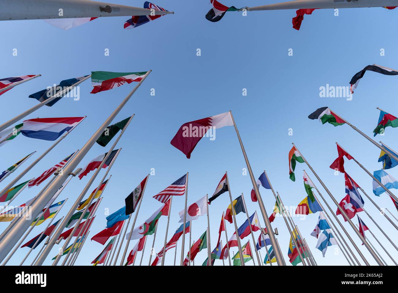 Flags of the different countries against the blue sky Stock Photo - Alamy