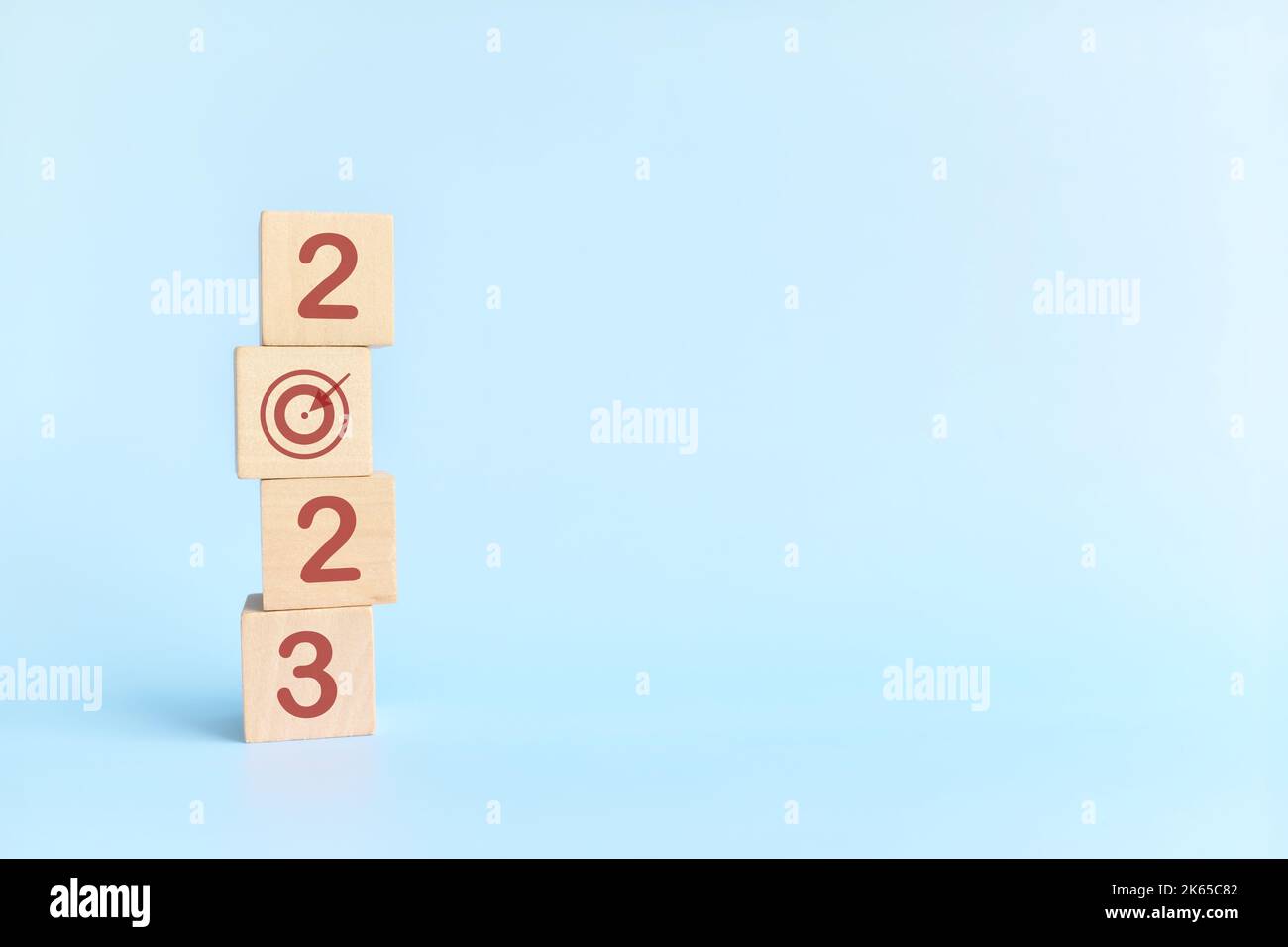 Start New Year 2023 business target goal concept. Human hand stacking