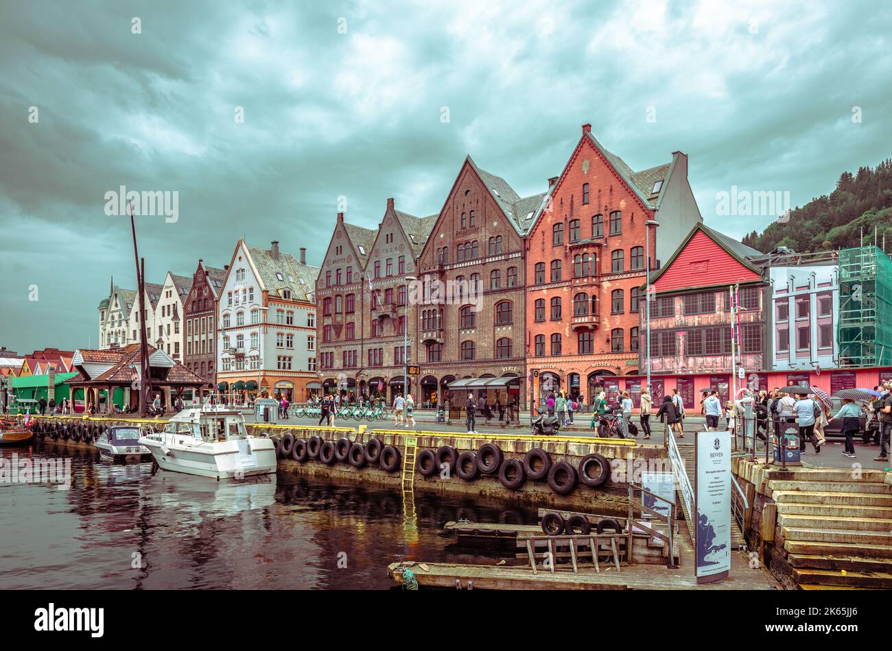 View of Bryggen, Bergen, Norway, on a rainy day, with the Hanseatic heritage commercial buildings lining up the eastern side of the Vågen harbour. Stock Photo