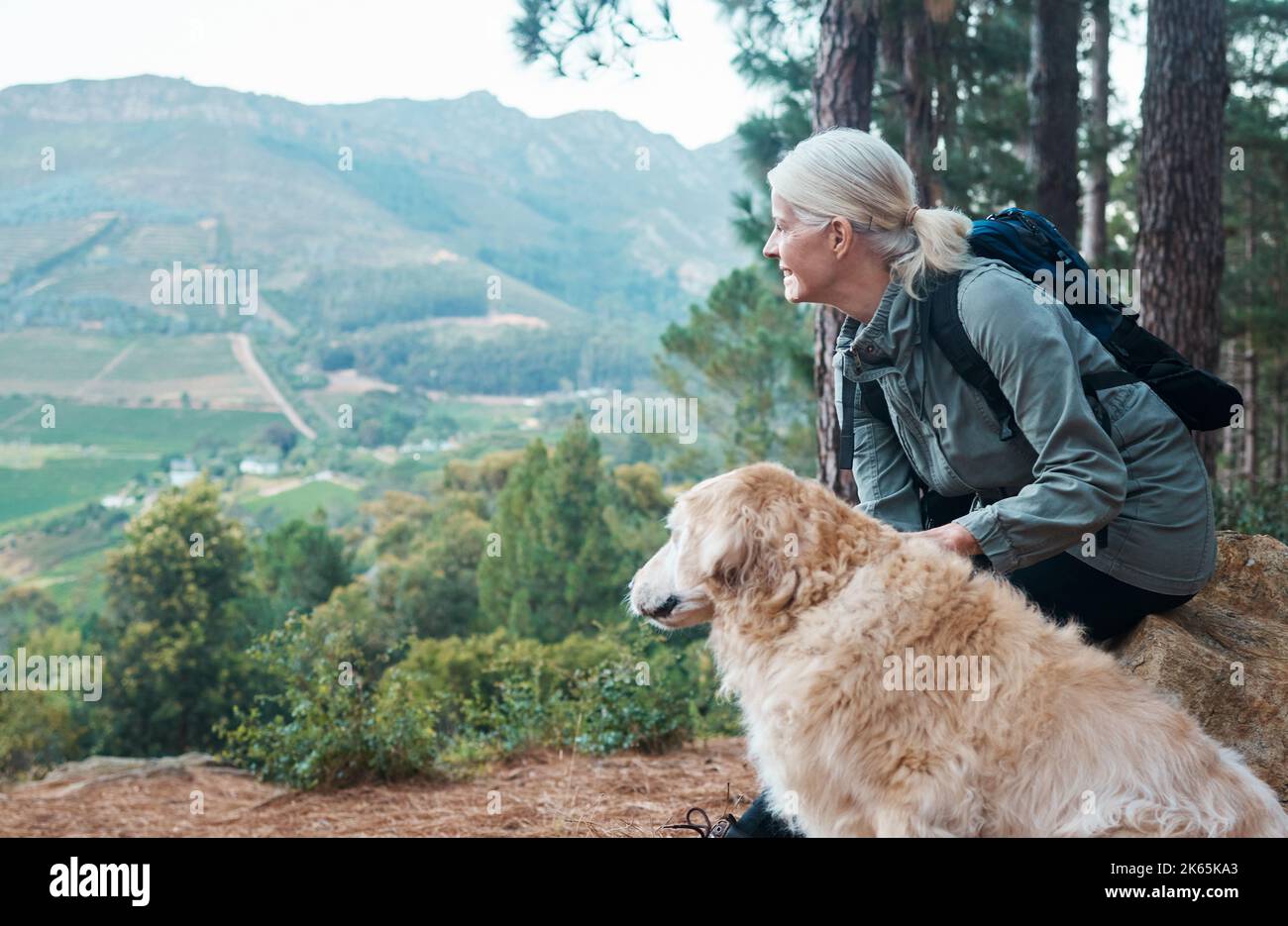 Its So Peaceful Out Here A Mature Woman And Her Dog Out For A Hike its-so-peaceful-out-here-a-mature-woman-and-her-dog-out-for-a-hike
