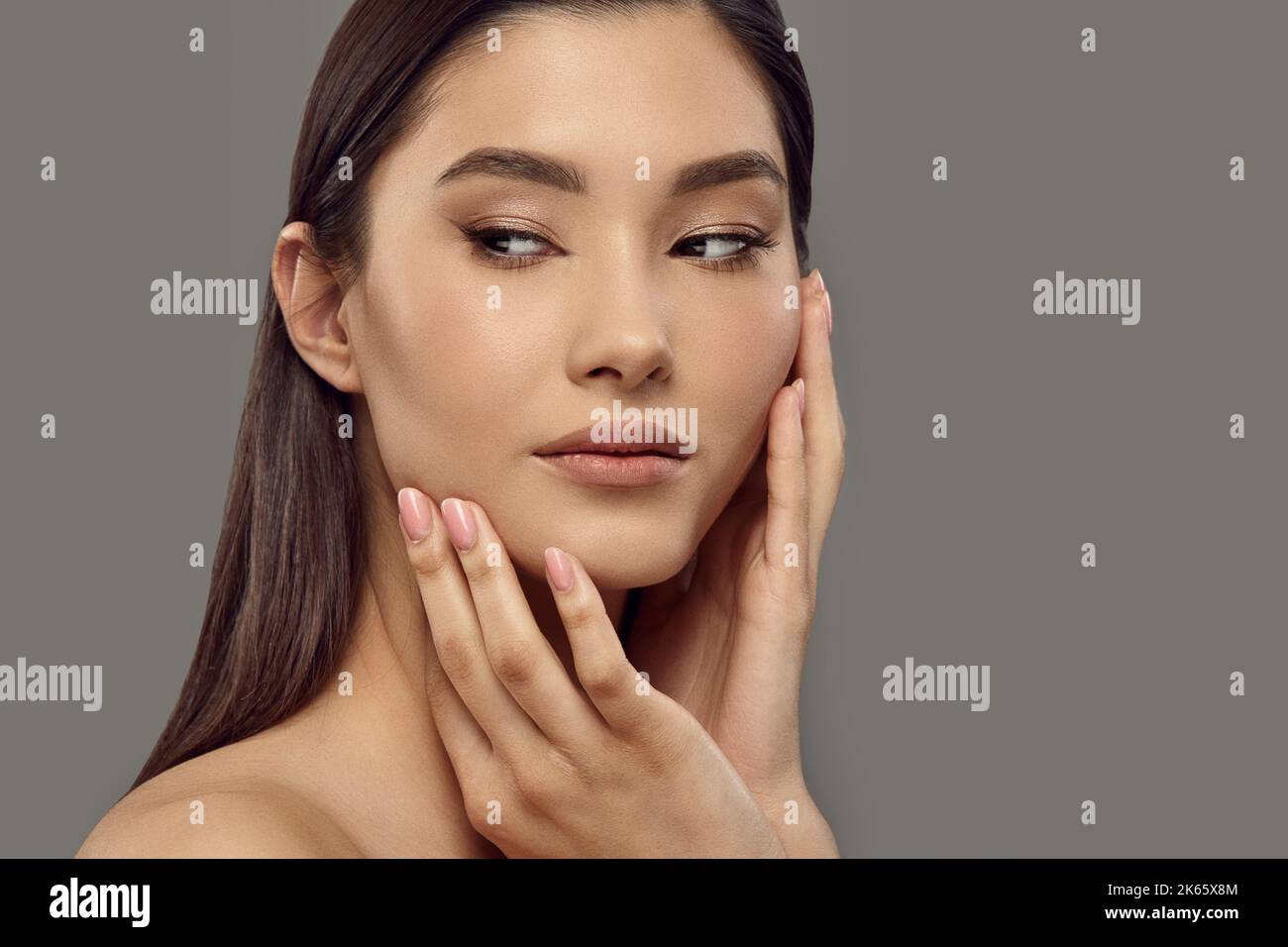 Girl touching her face with hands enjoying soft smooth skin Stock Photo ...