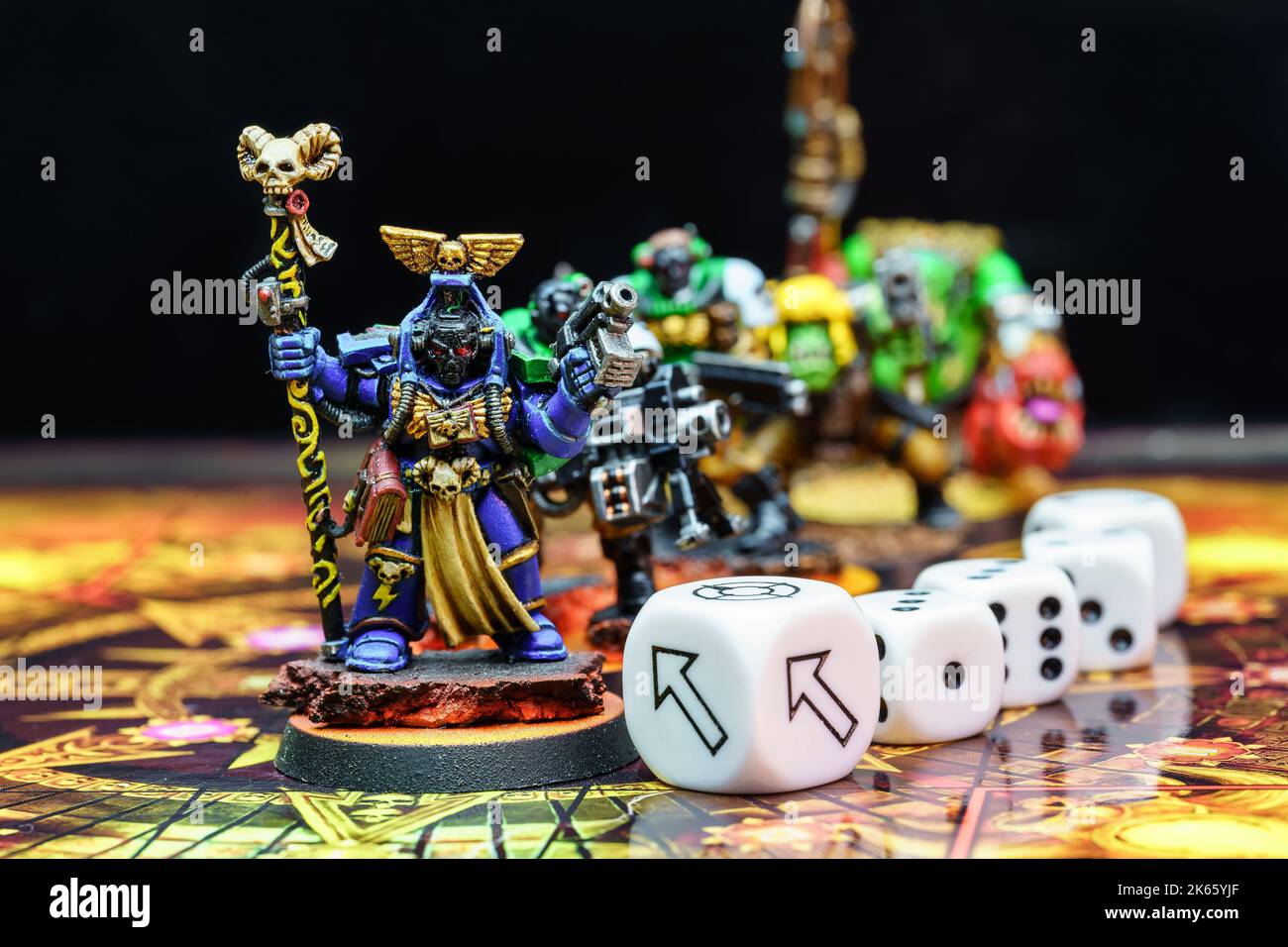 Figures of role-playing board games, dice and board to play in between several players. Stock Photo