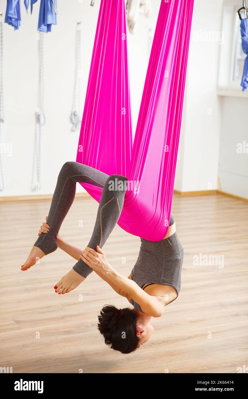 Inversion bow pose in aero yoga. Aerial exercises Stock Photo Alamy