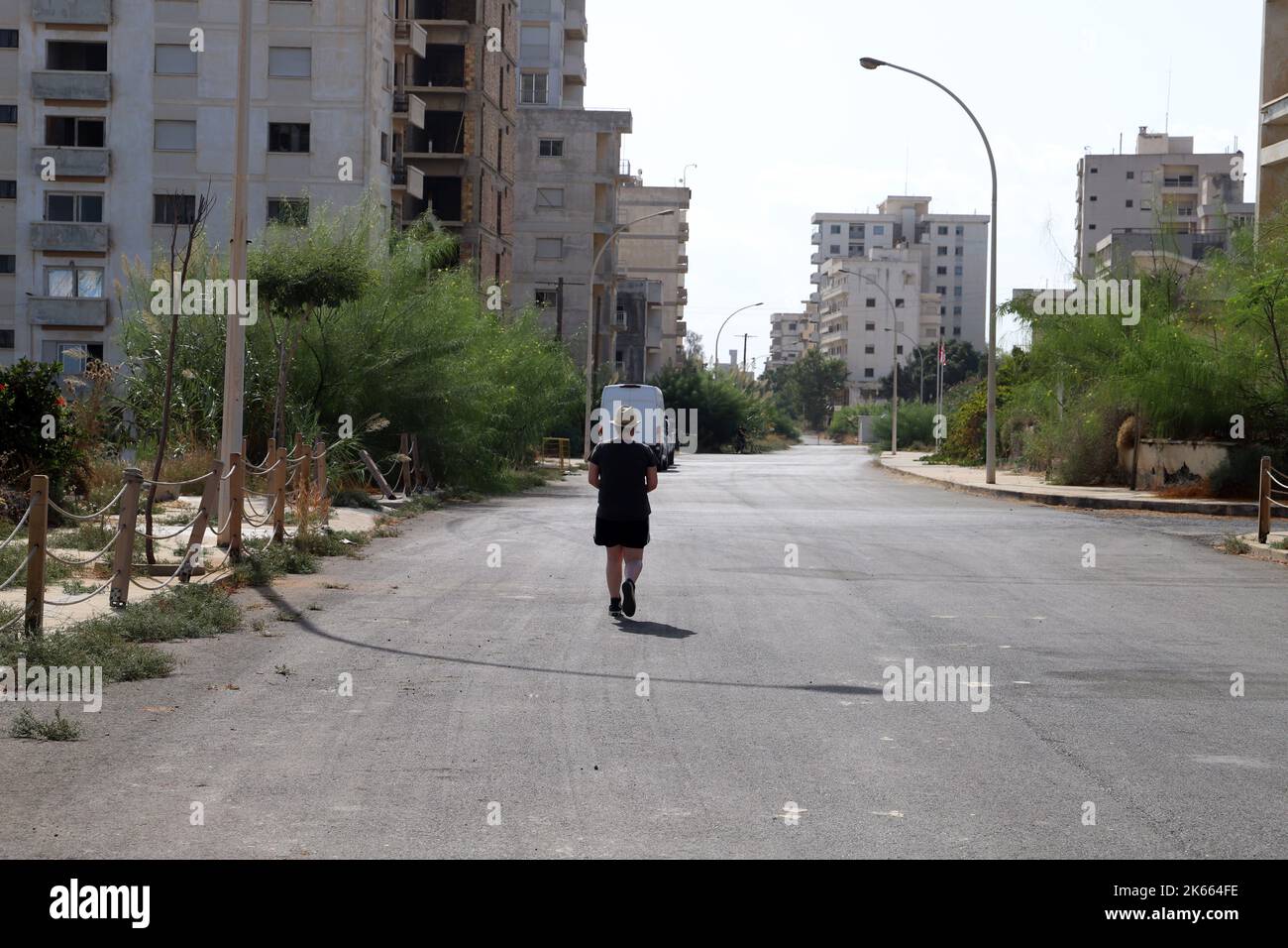 Tourists on the deserted streets of Varosha, Famagust's 'Ghost Town'.Turkish Repulic of Northern Cyprus Stock Photo