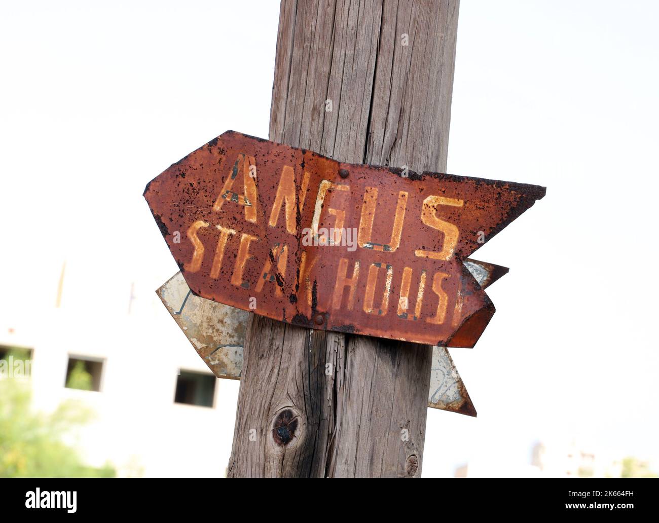 Sign pointing to Angus Steakhouse in Varosha Ghost Town; Famagusta (Gazimagusa); Turkish Replublic of Northern Cyprus Stock Photo