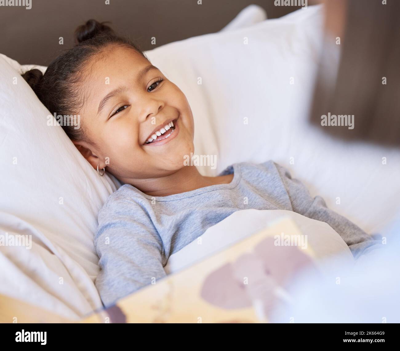 Child tucked bed hi-res stock photography and images - Alamy