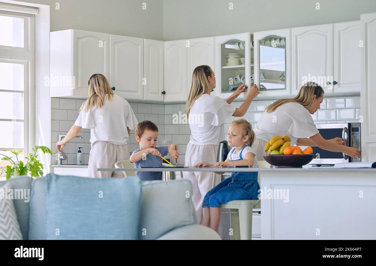 Busy mom feeding kids and cleaning the house. Little girl and boy sitting and eating in the