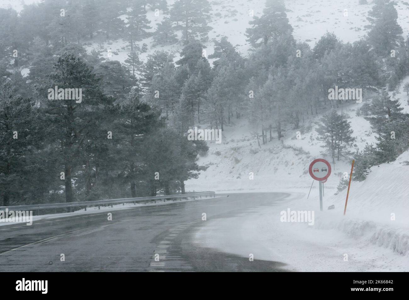 Road in mountain snowy forest hi-res stock photography and images - Alamy