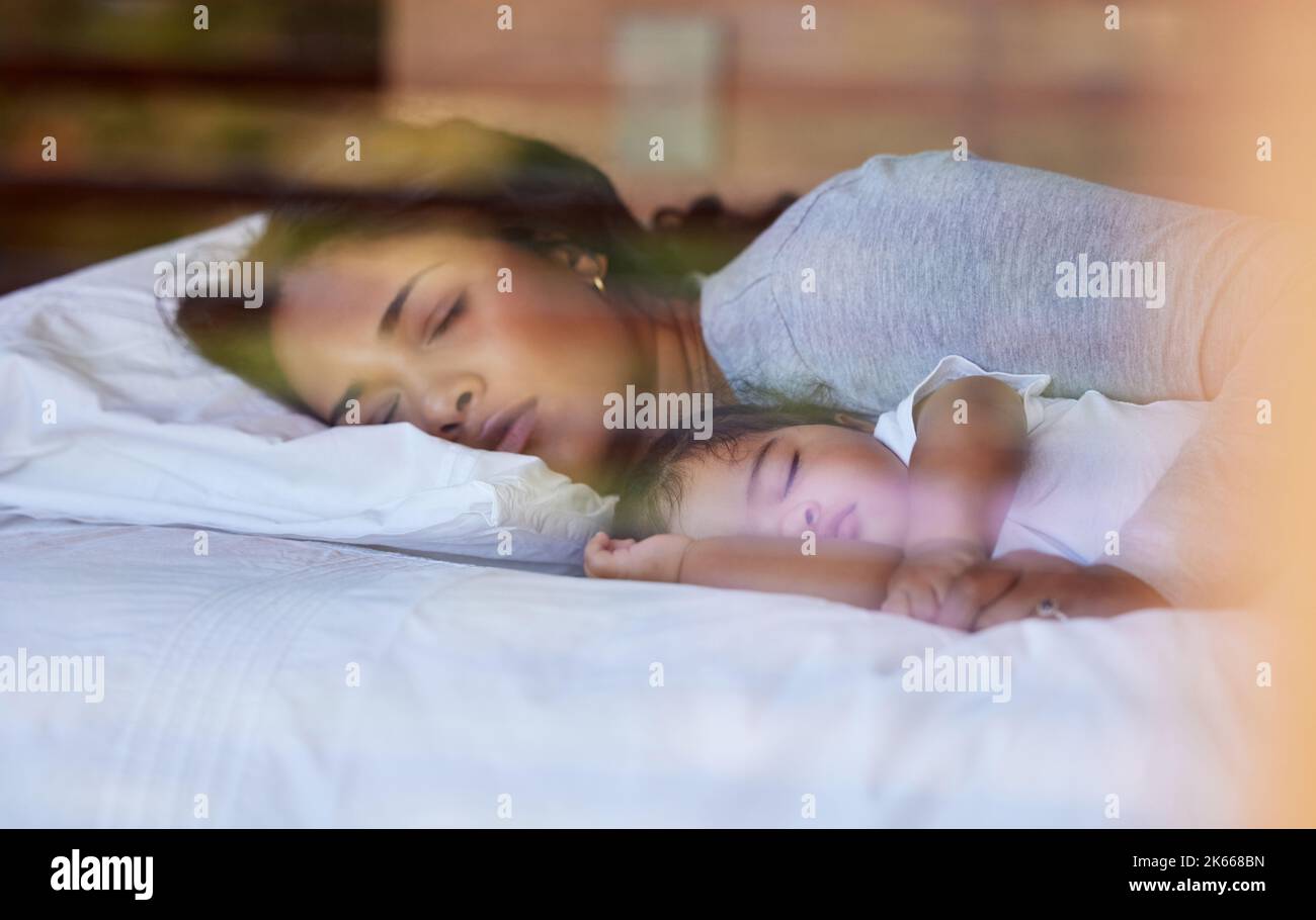 Mother daughter bed baby sleeping dreaming Stock Photo