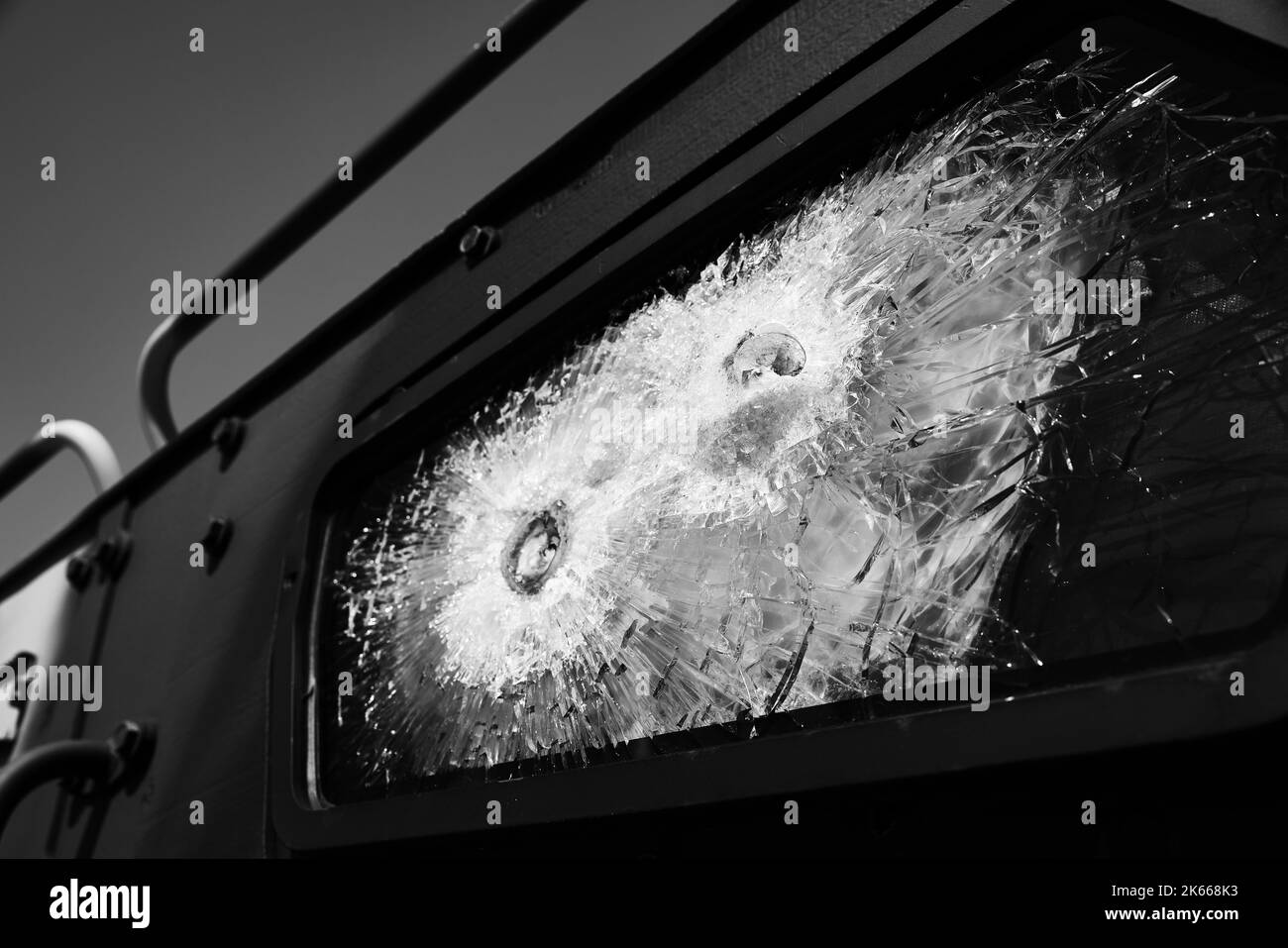 Bulletproof glass. Armored car after the shelling. Armored glass after