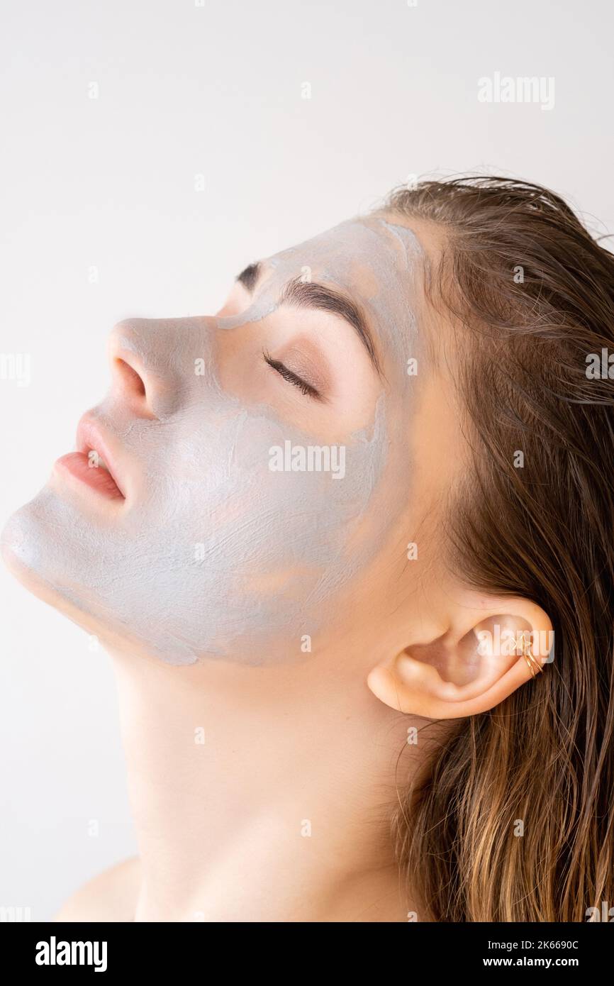 facial skin care cosmetics woman in clay mask Stock Photo