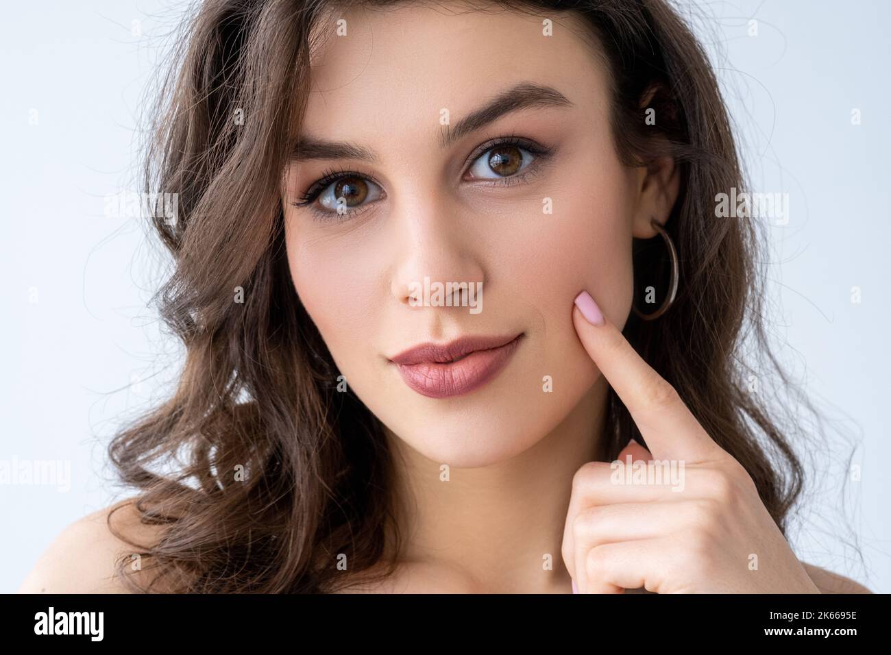 beauty enhancement woman touching face cheek skin Stock Photo Alamy