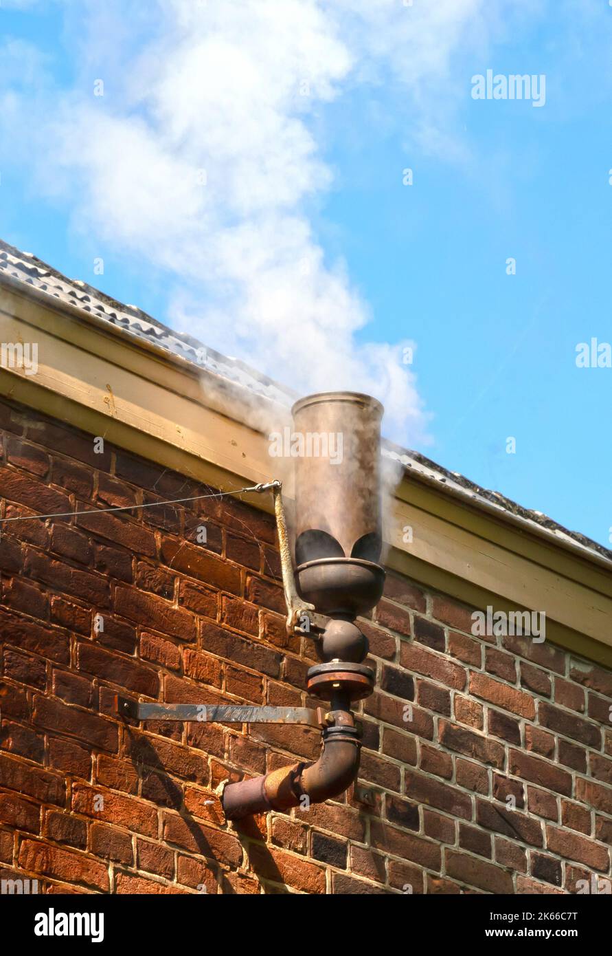 Steam whistle in a brick wall, old laundry in action Stock Photo Alamy