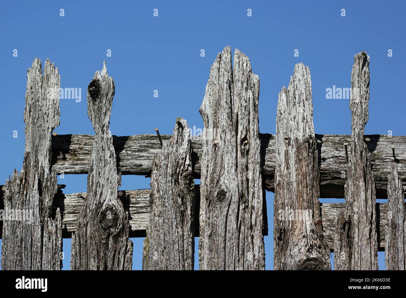 Weathered and worn gray wooden fence Stock Photo - Alamy