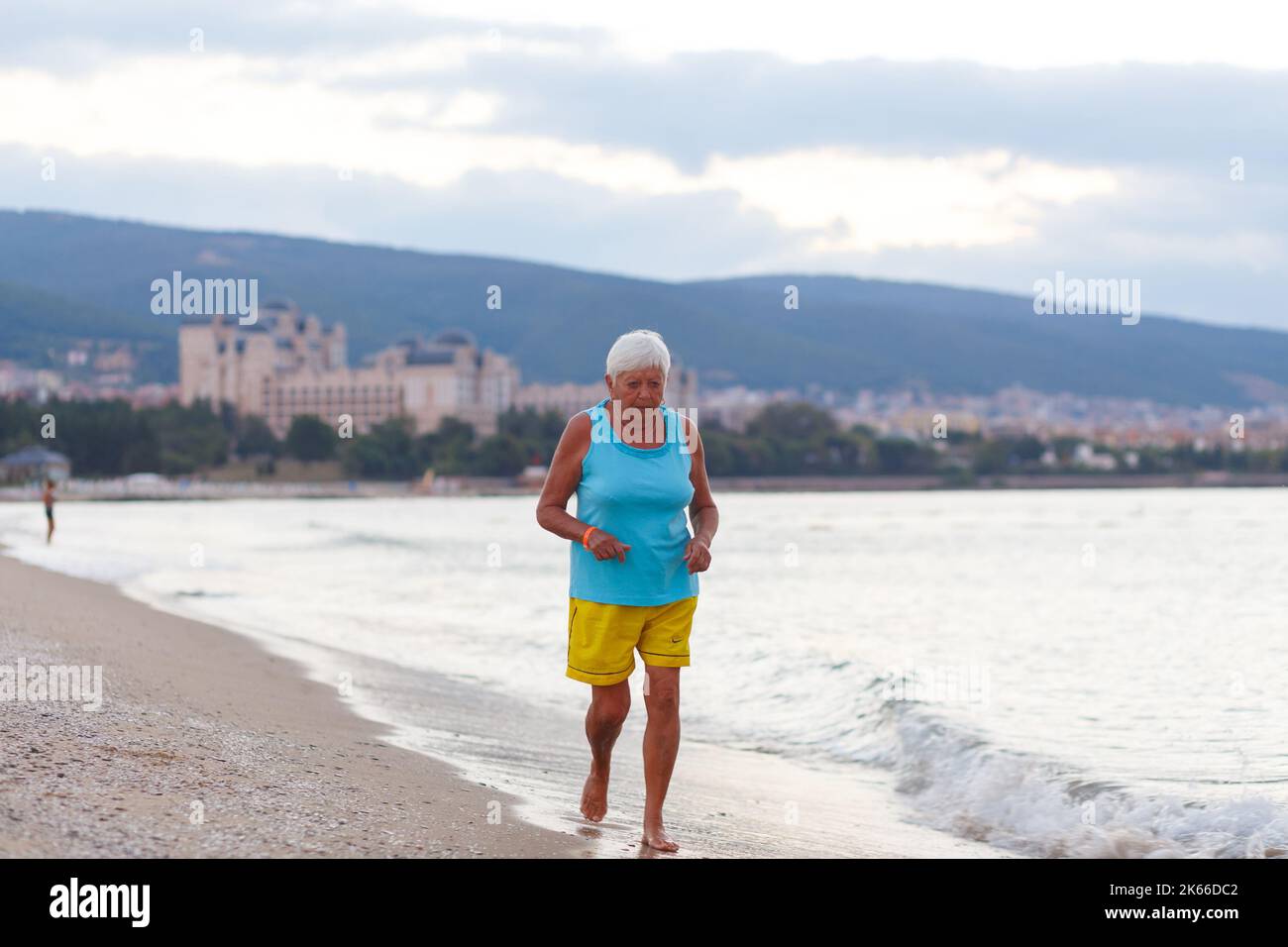 Nessebar, Bulgaria - September 01, 2016: Woman jogging outdoors on morning beach Stock Photo