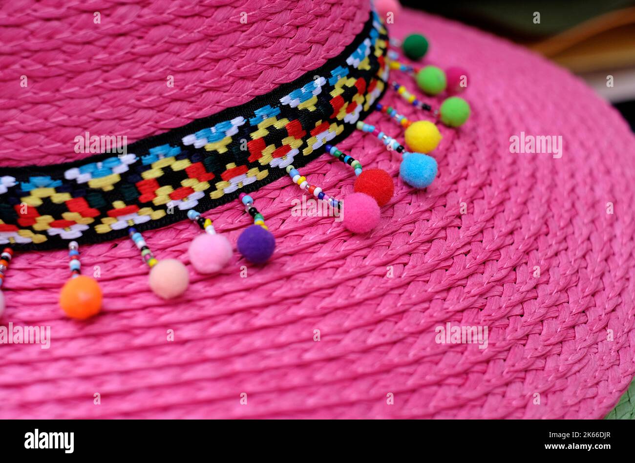 decoration on bright pink straw hat Stock Photo