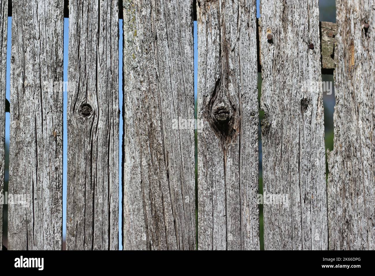 Weathered and worn gray wooden fence Stock Photo - Alamy
