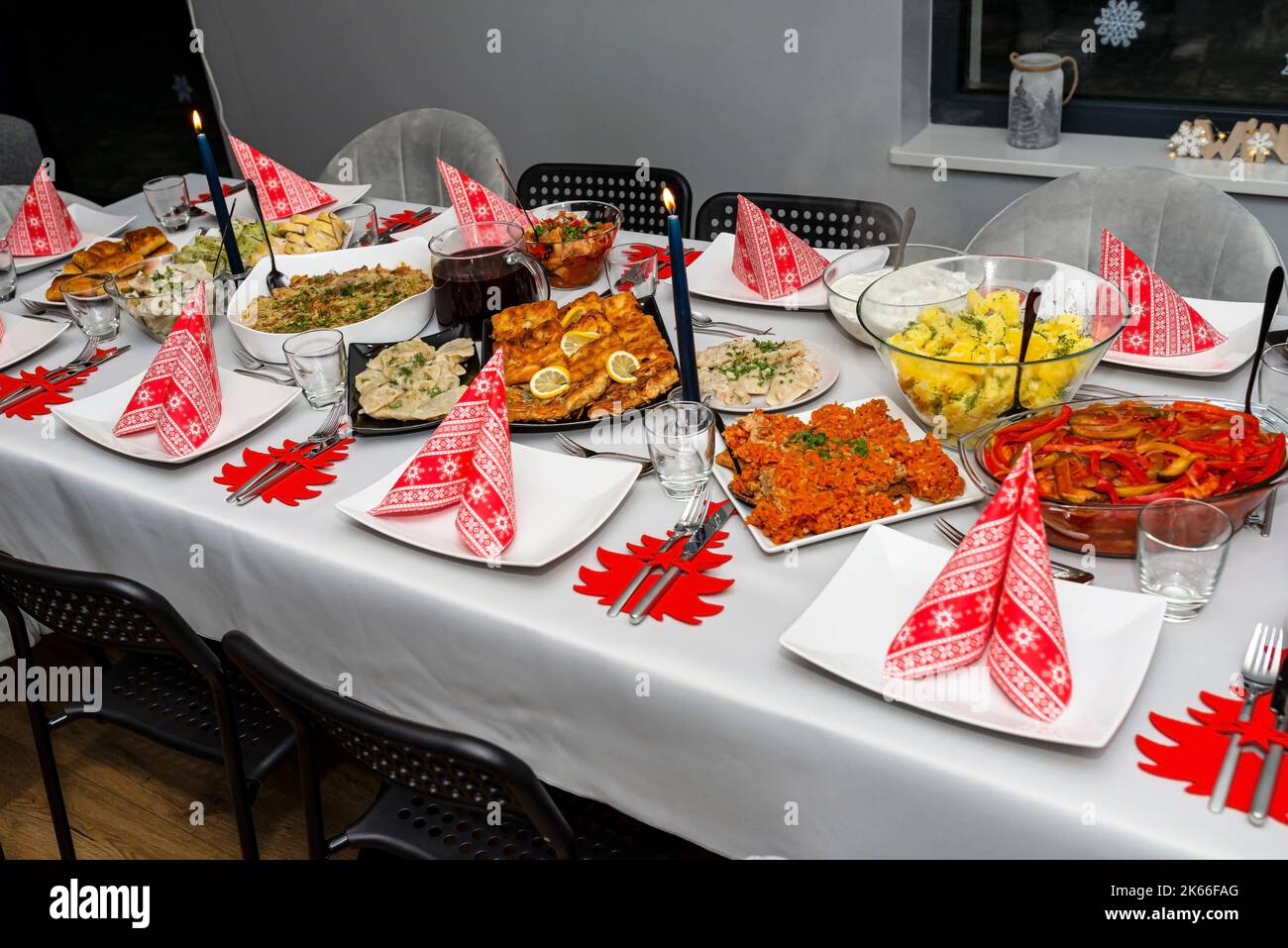 A table set before Christmas dinner with many traditional Polish dishes. Stock Photo