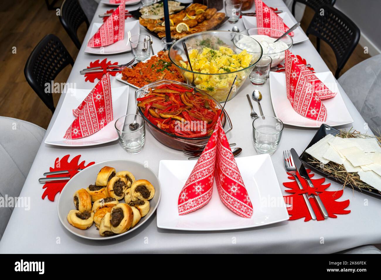 A table set before Christmas dinner with many traditional Polish dishes. Stock Photo