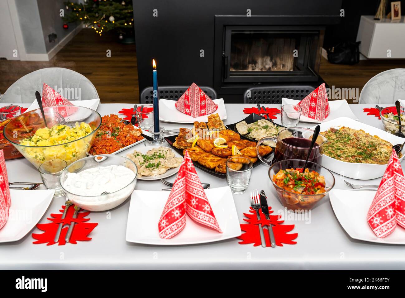 A table set before Christmas dinner with many traditional Polish dishes. Stock Photo