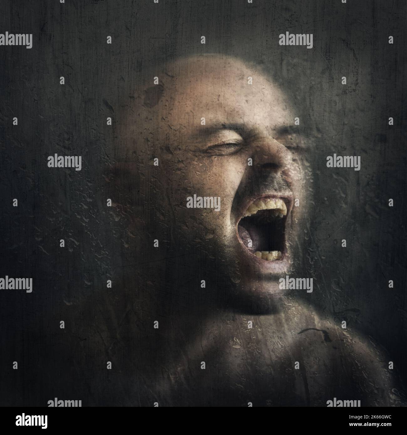 portrait of man shouting in anger and fear Stock Photo