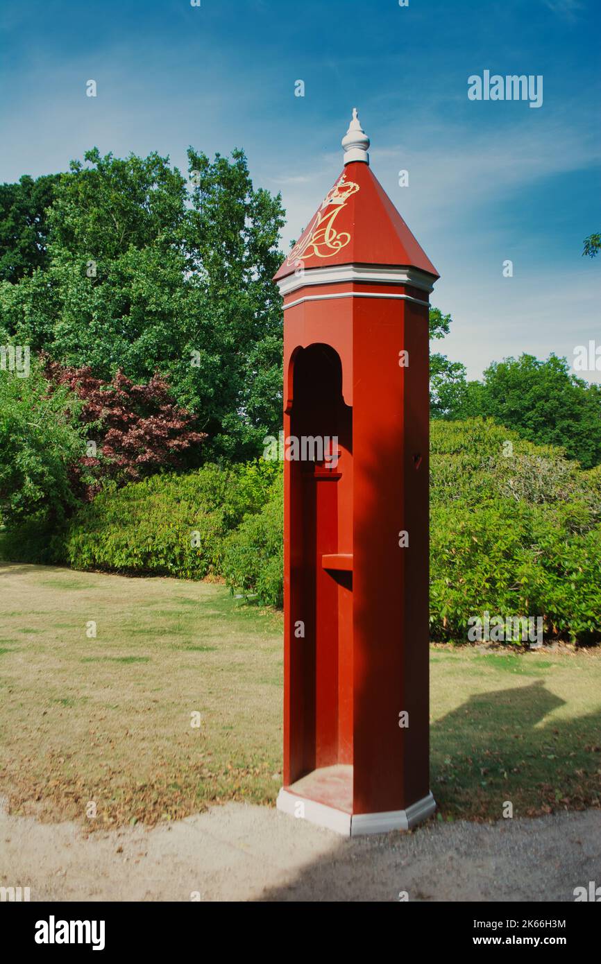 Red sentry box, in front of Gravenstein Palace of the royal danish family Stock Photo