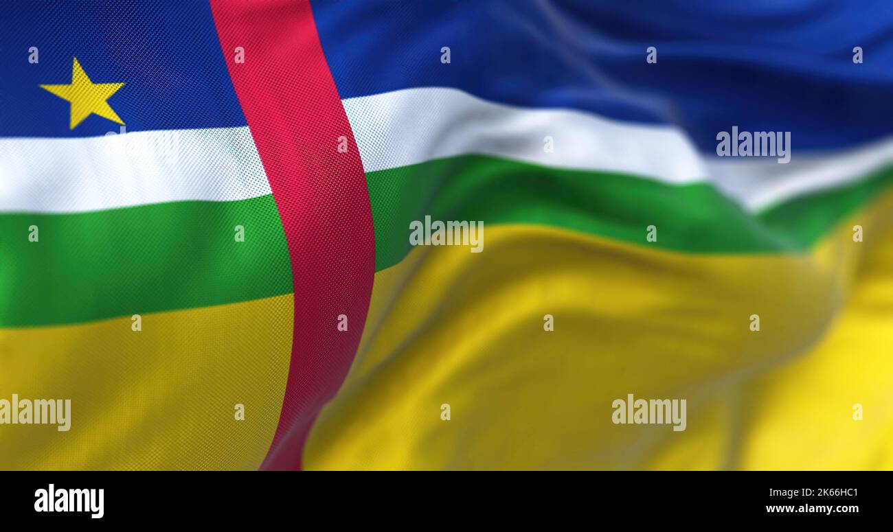 Close-up view of the Central African Republic national flag waving in the wind. Fabric textured background. Selective focus Stock Photo