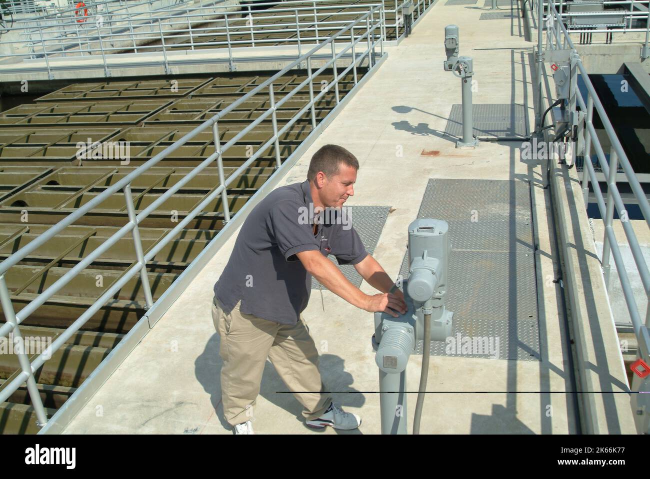 Waste treatment plant system operator hires stock photography and