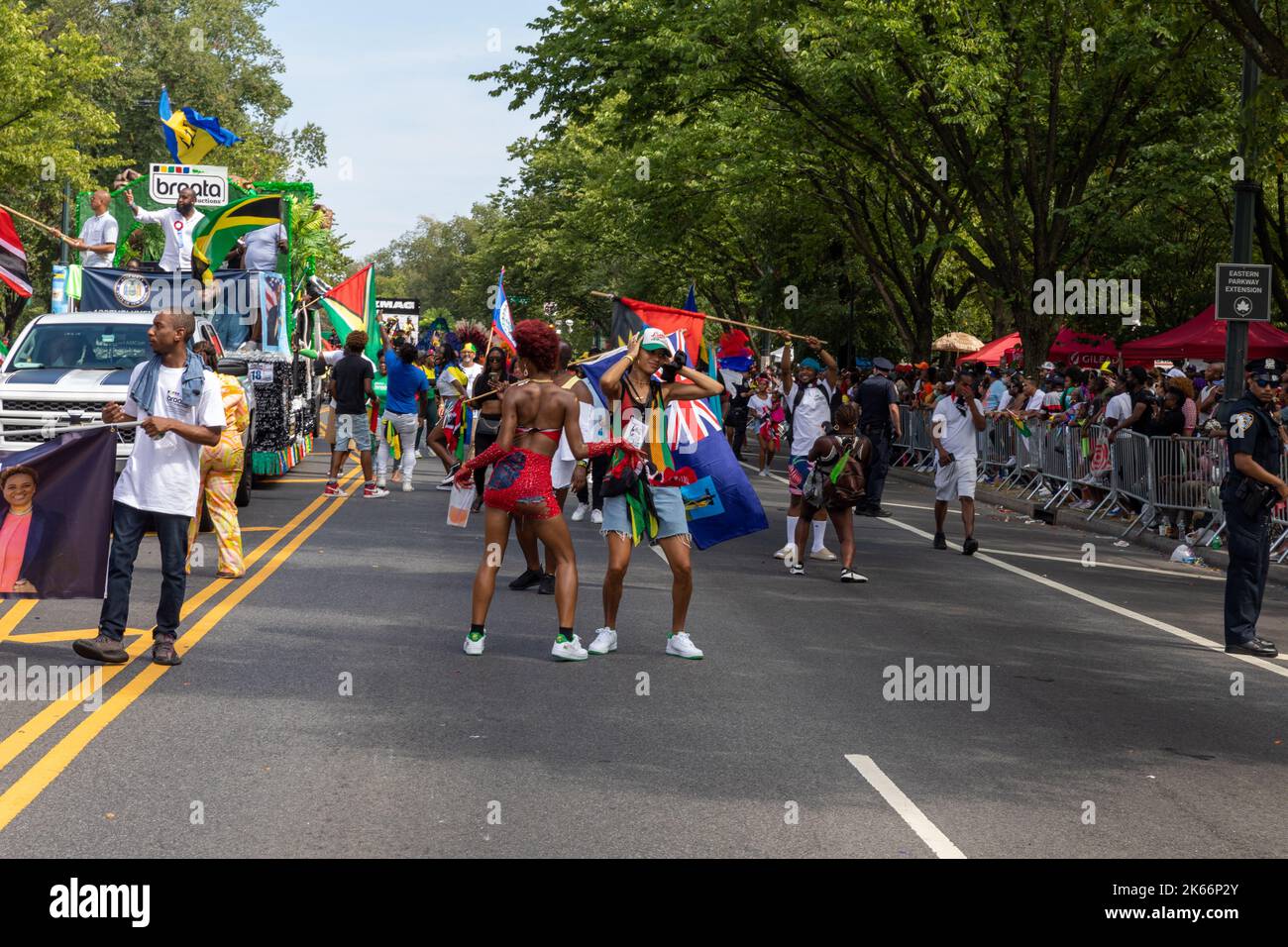 A crowd of people in the streets celebrating West Indian Labor Day