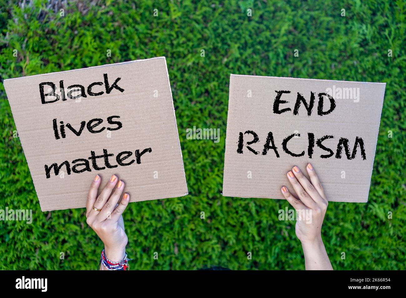 hands of young people holding cardboard signs with slogans against racism Stock Photo