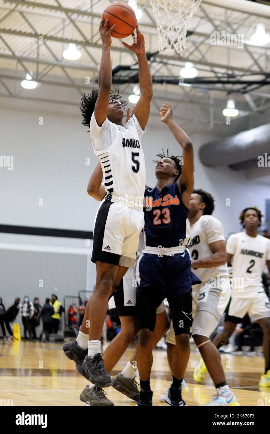 A vertical shot of a player scoring during the Hammond vs Westside High