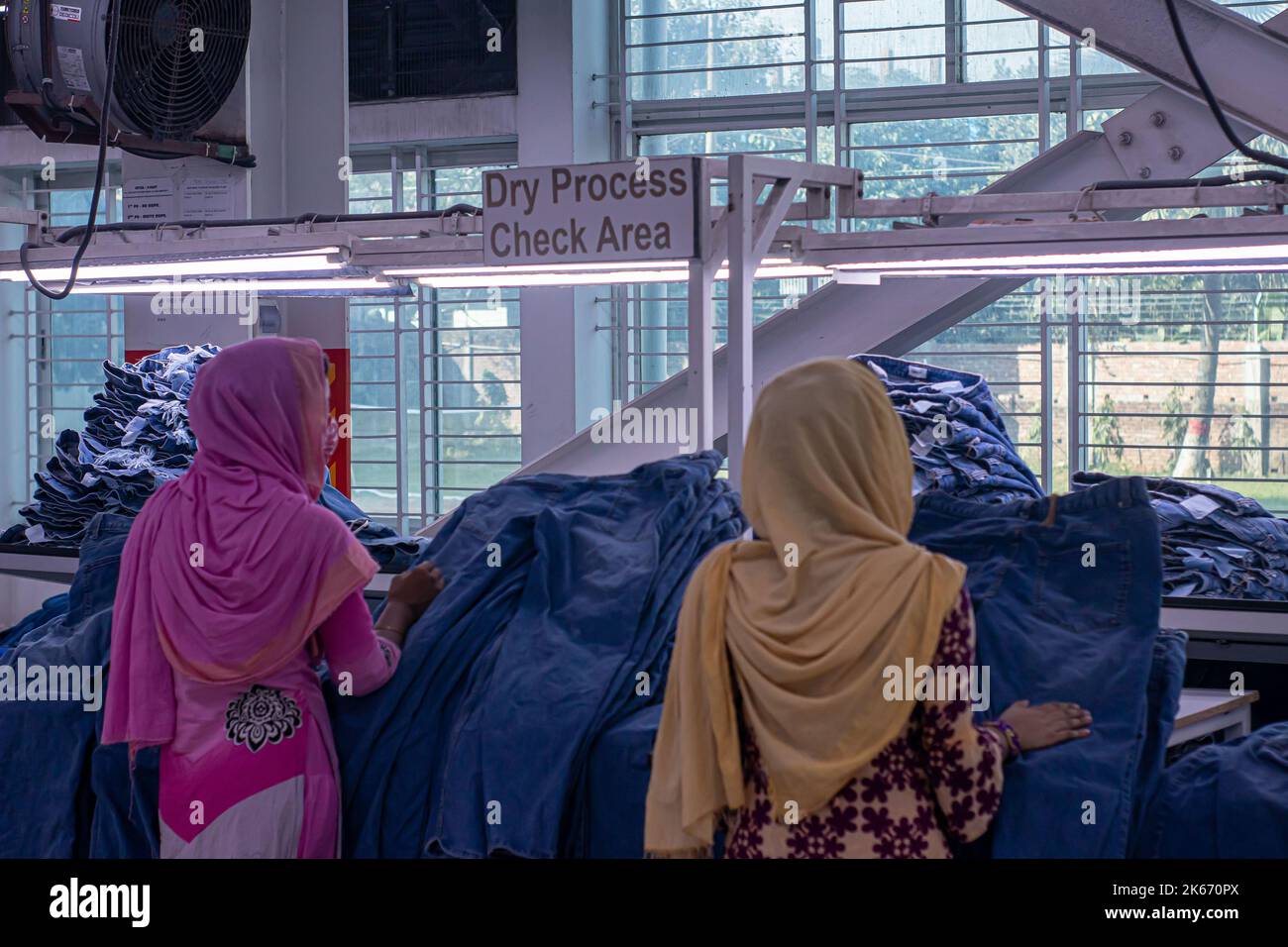 Gazipur, Dhaka, Bangladesh. 12th Oct, 2022. Workers make clothes at a