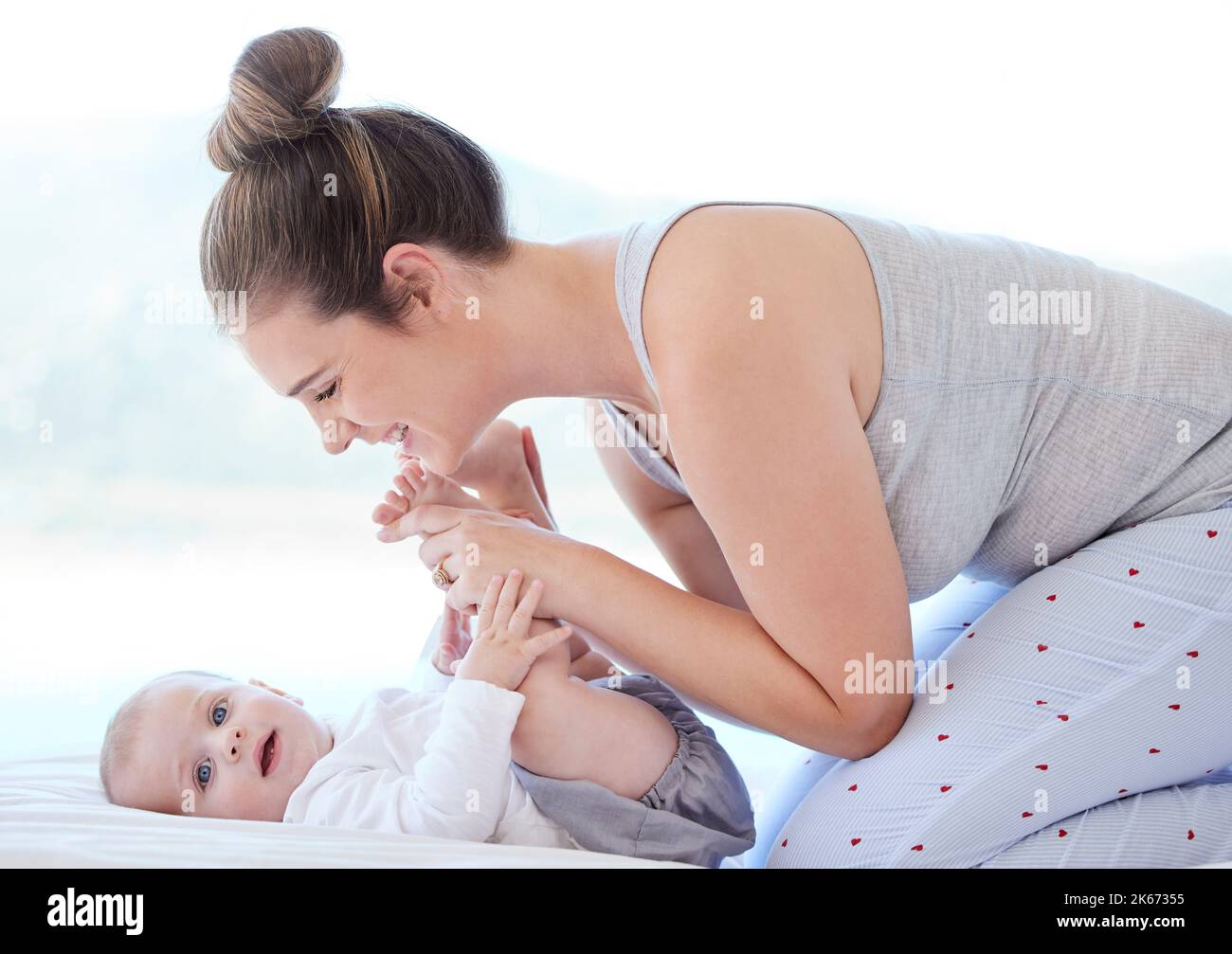 Mine by coincidence or by design. a young mother bonding with her adorable baby boy at home. Stock Photo