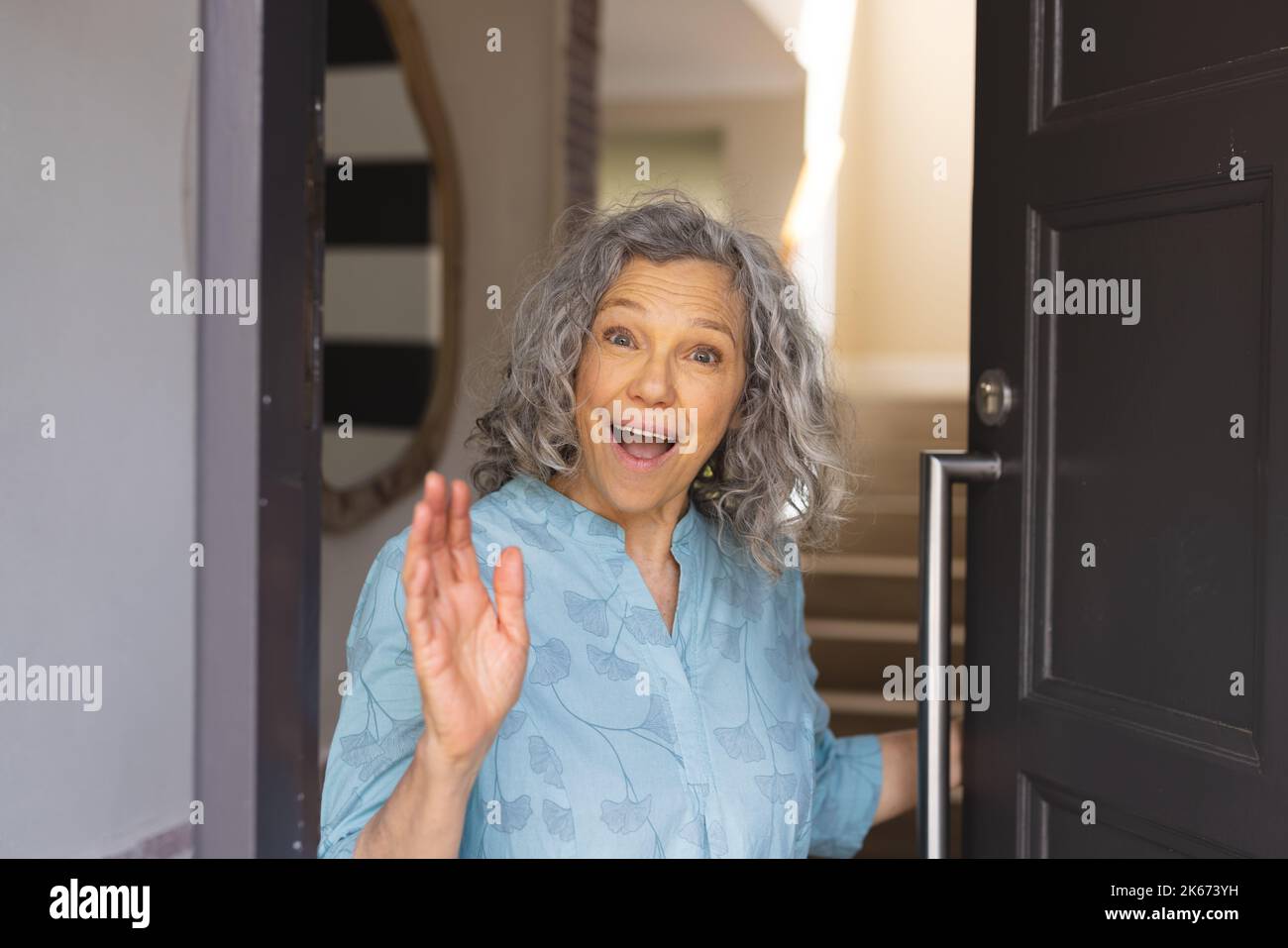 Welcoming someone at the door hi-res stock photography and images - Alamy